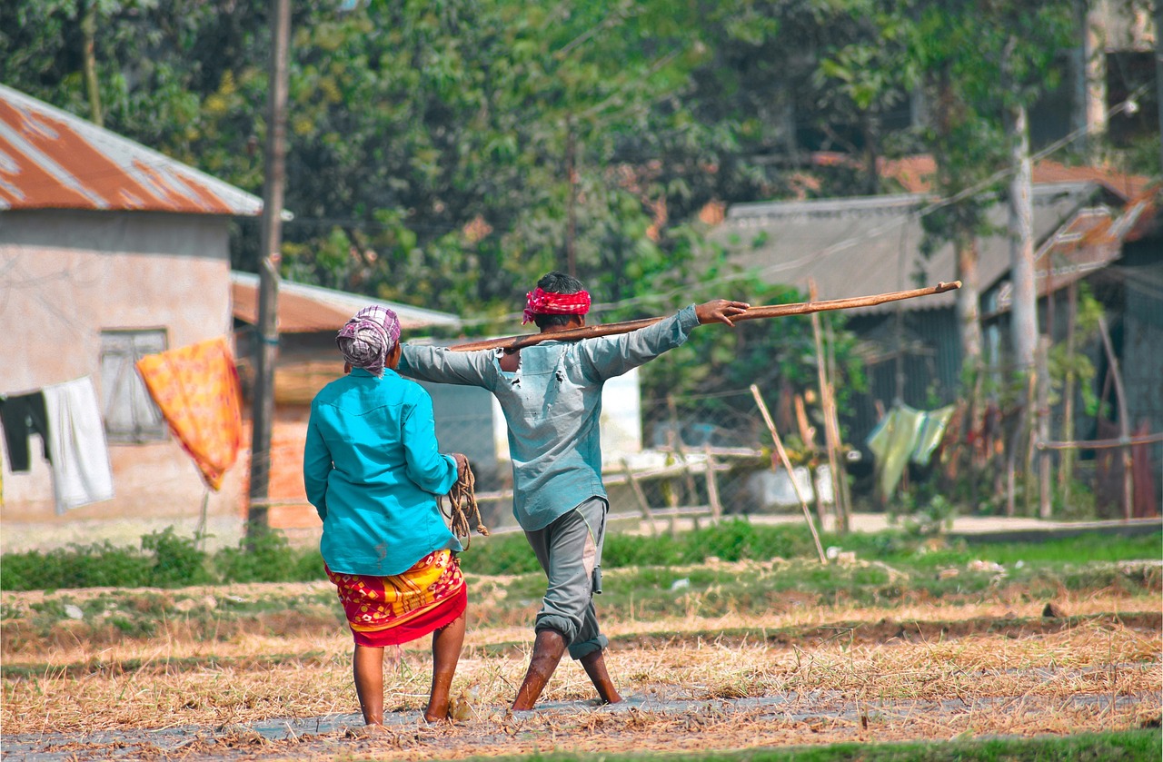 A farmer couple walking through the farm
