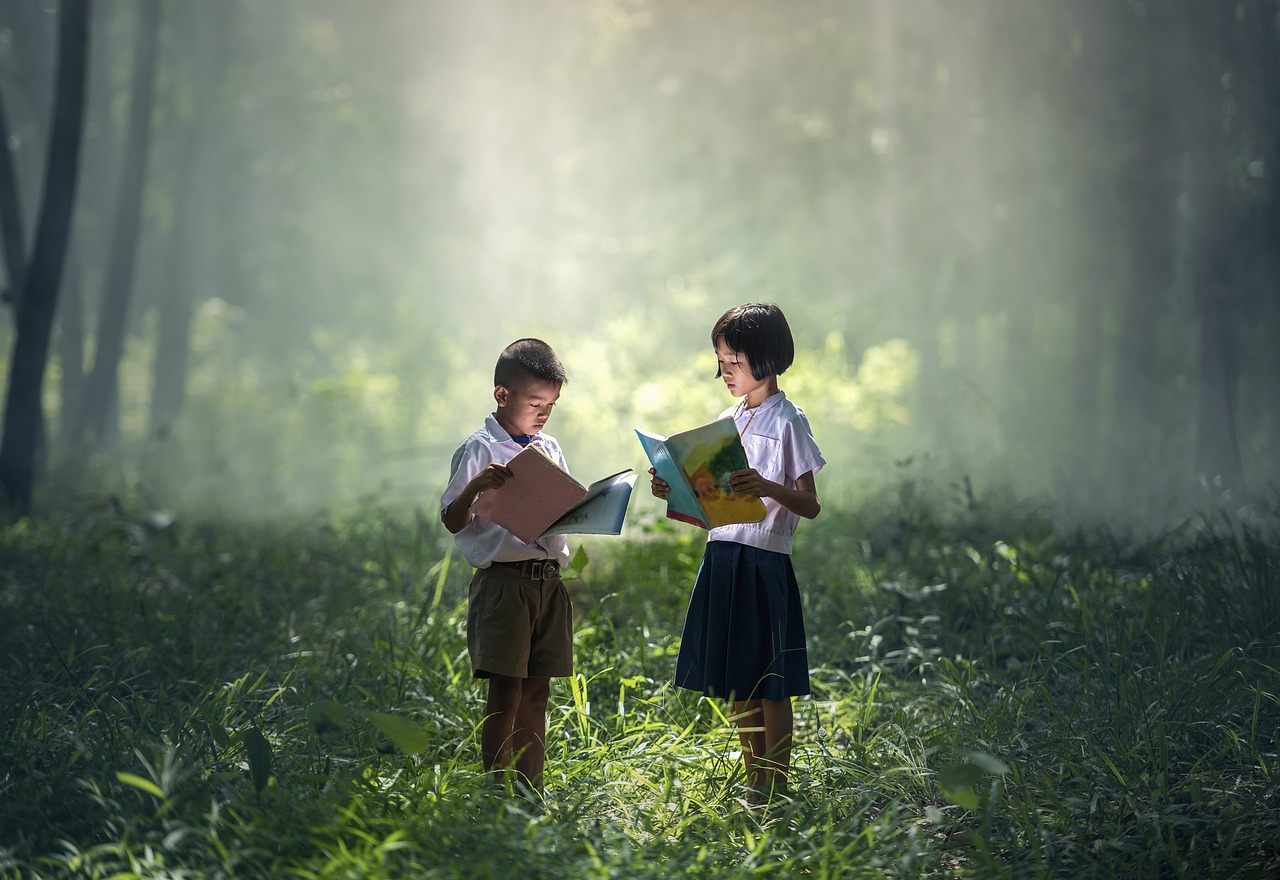 boy and girl reading books