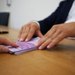 two hands showing borrowing money