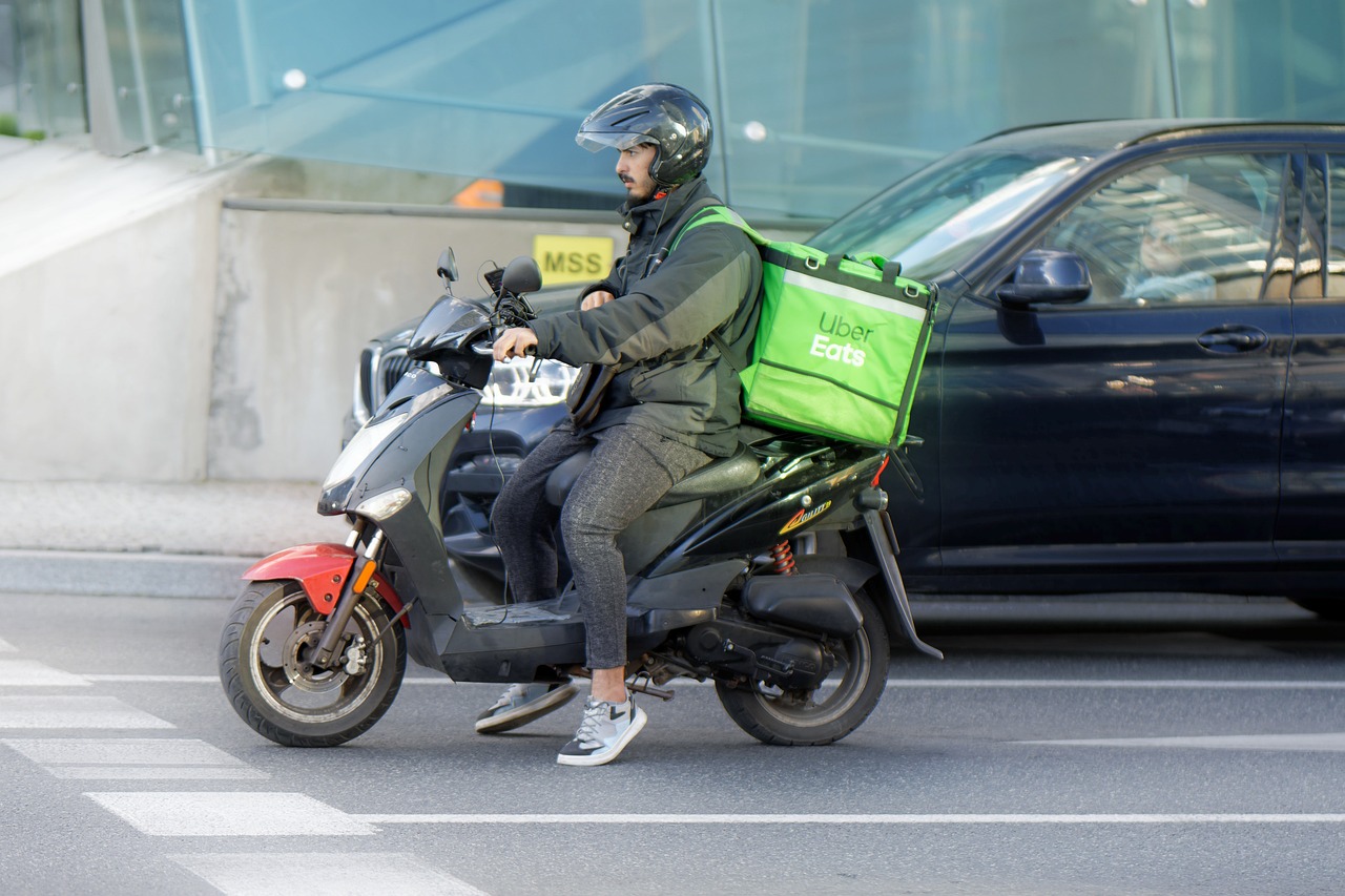 food delivery guy on a scooter