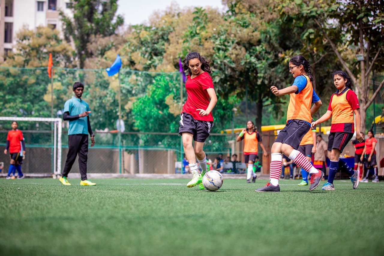 school kids playing football