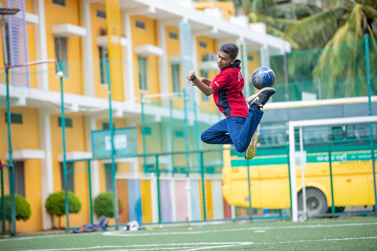 school kid playing football