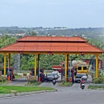 picture of a toll plaza with trucks and cars