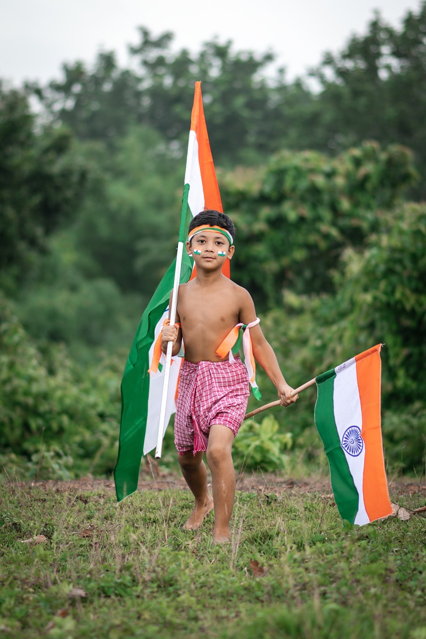 boy carrying Indian flags