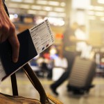 Hand with boarding pass in airport