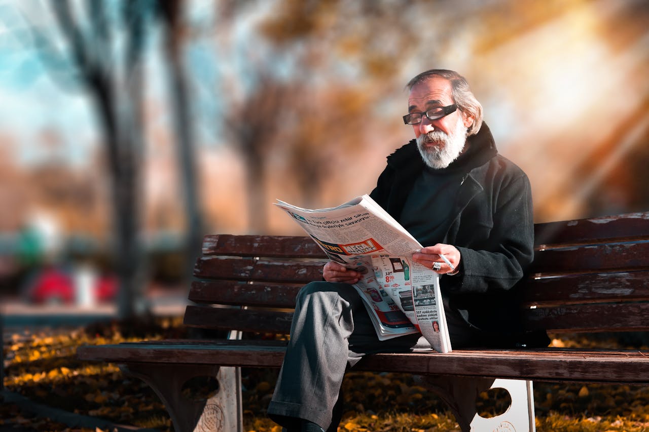Old man reading newspaper - relates to Pensioners Guide to Time Management, Tackle New Routines, win Retirement Boredom