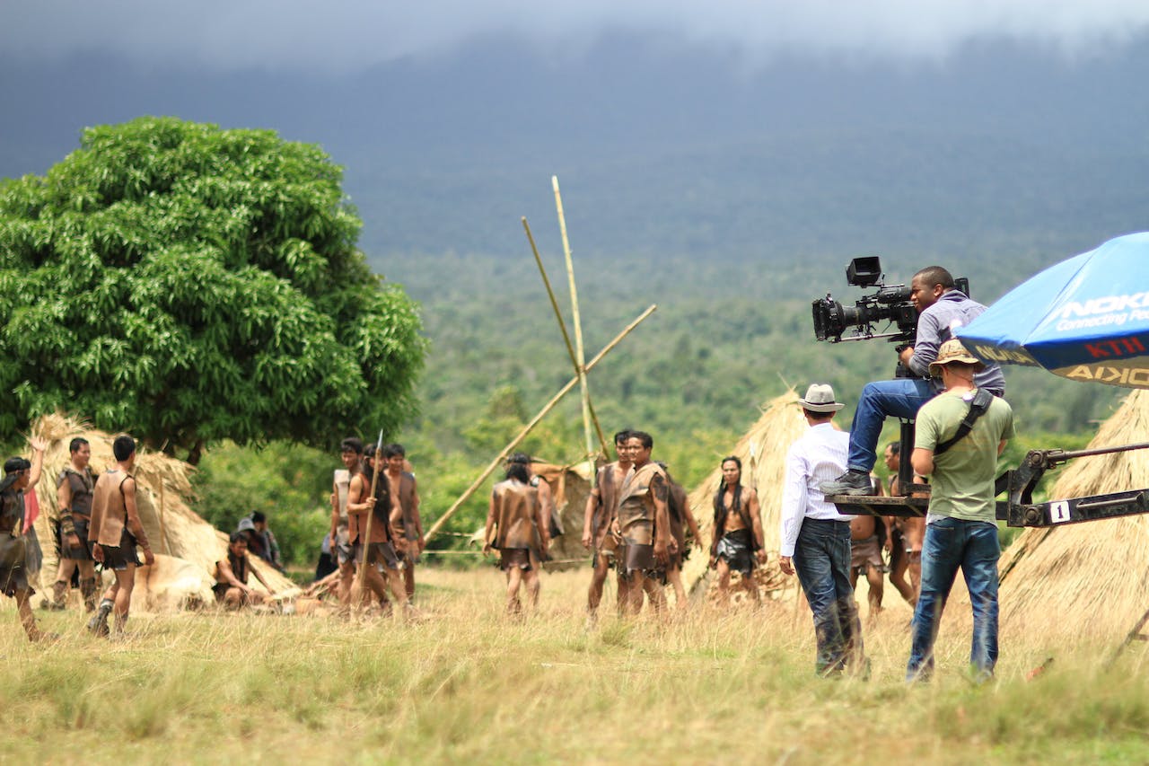 Camera crew at grass fields shooting -image relates to Jobs Beyond Acting! Non-Acting Jobs in the Entertainment Industry