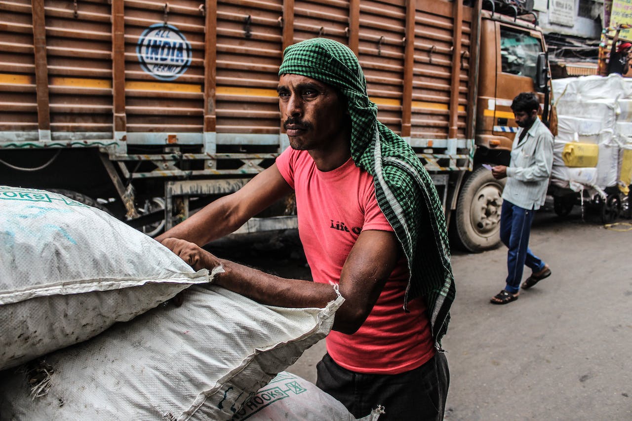 Indian Male Worker working - image tries to explain the dynamics of male worker migration in India