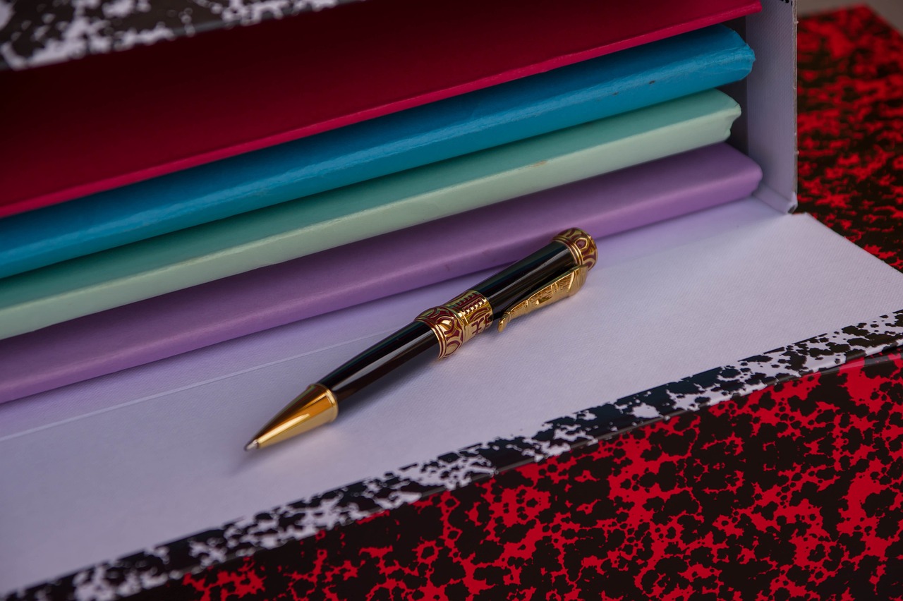 folder with files in it and pen