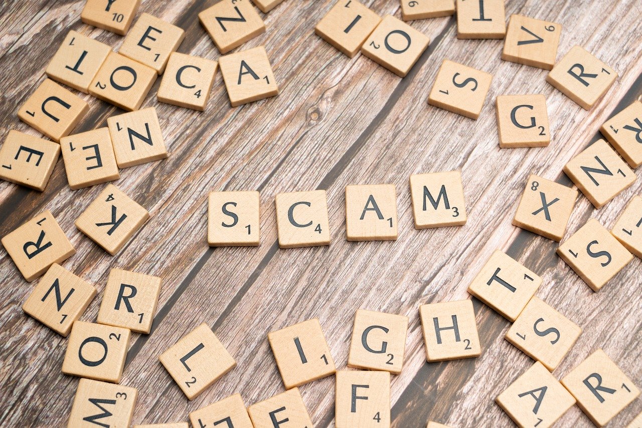 Tile letters creating the word SCAM - relates to Beware of the MGL Gas Bill Scam: Protect Yourself & Learn