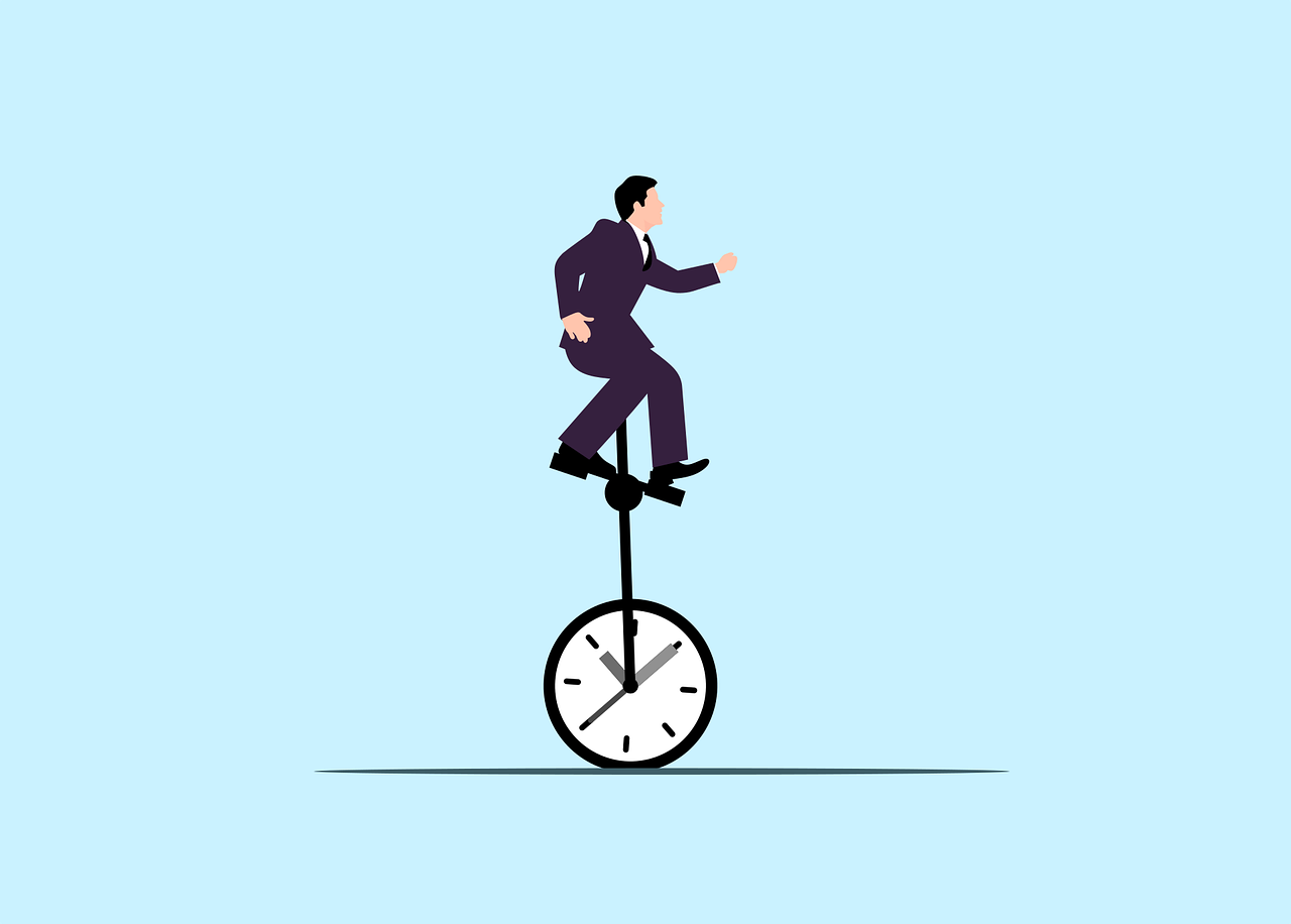 an office executive balancing on a cycle