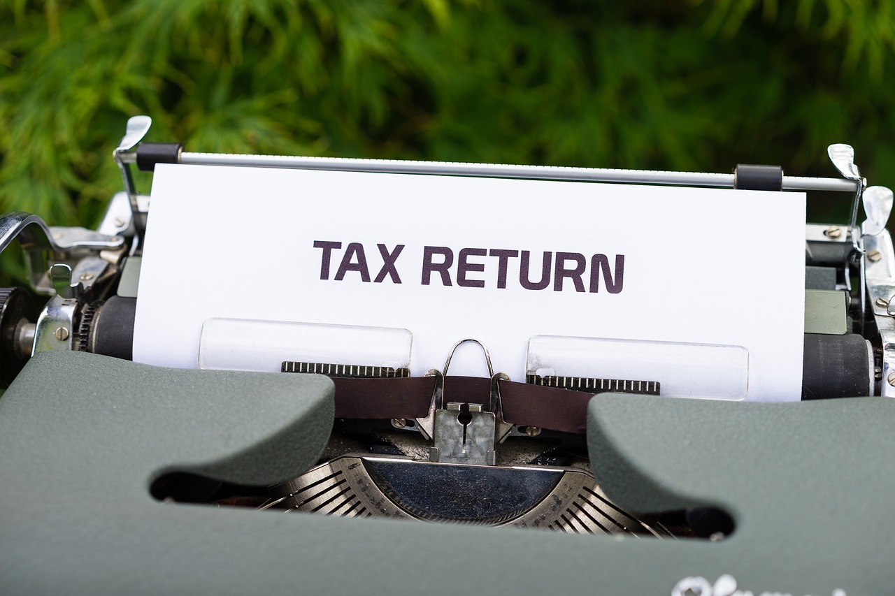 tax return being typed on a typewriter
