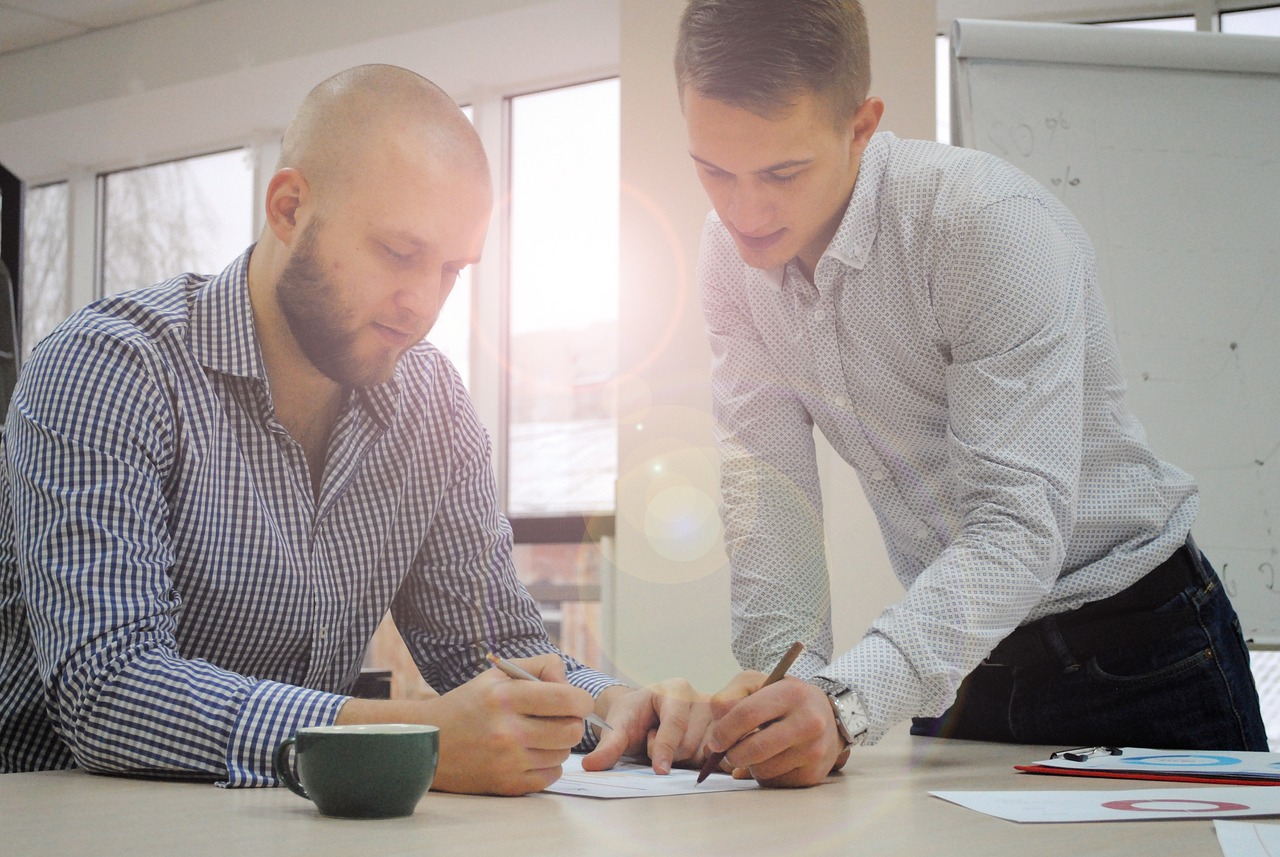 an officer helping a man with some documents