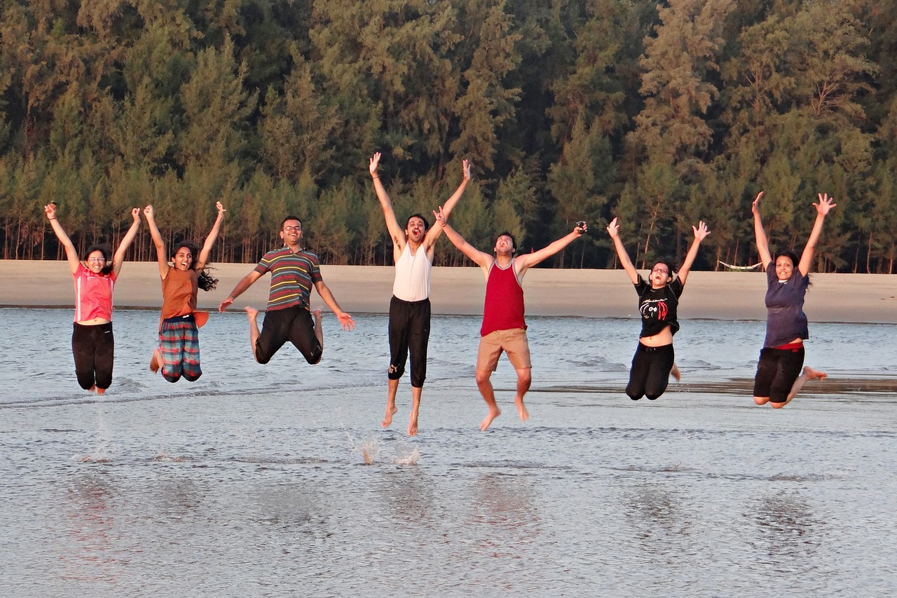youngsters jumping on beach